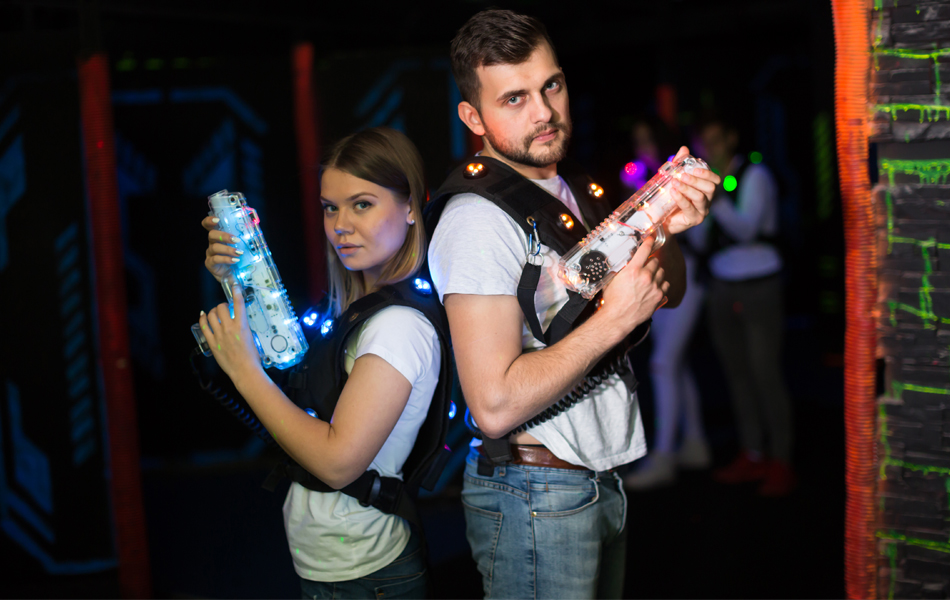people holding laser tags